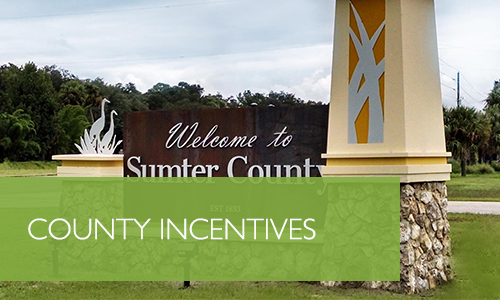 wooden sign with text: welcome to sumter county. county incentives.